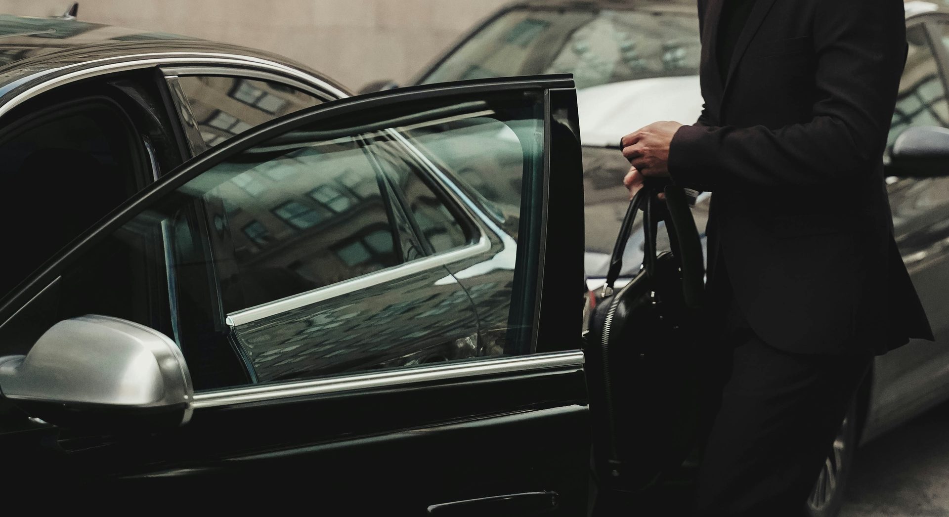 Professional client entering a private car service vehicle